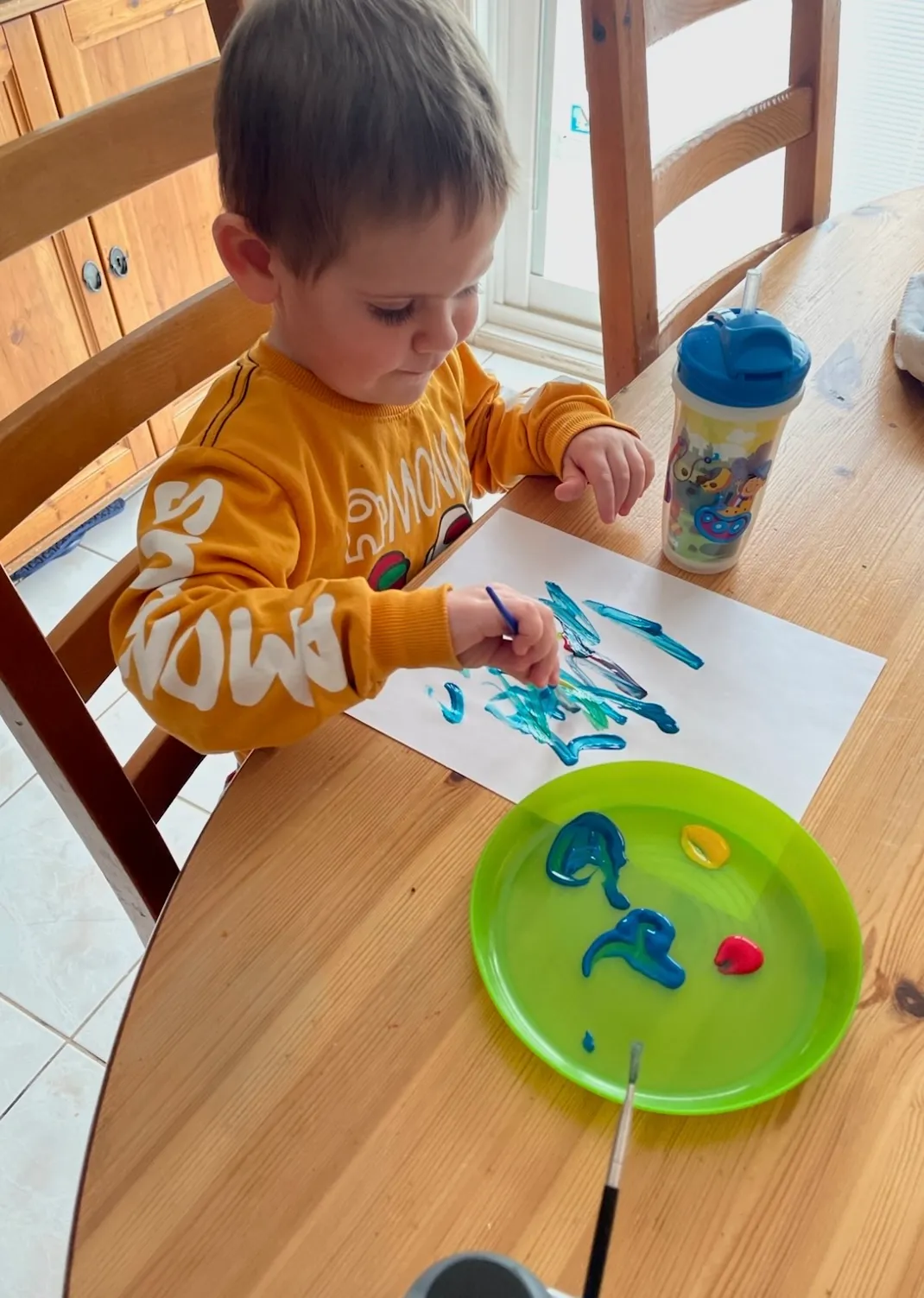 Photo of daycare kid creating art